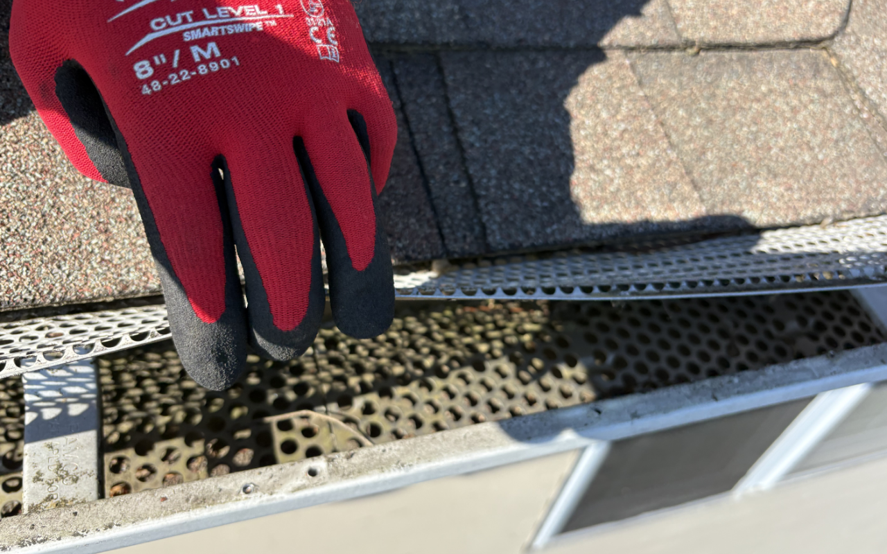 Early fall gutter cleaning before leaves and debris build up