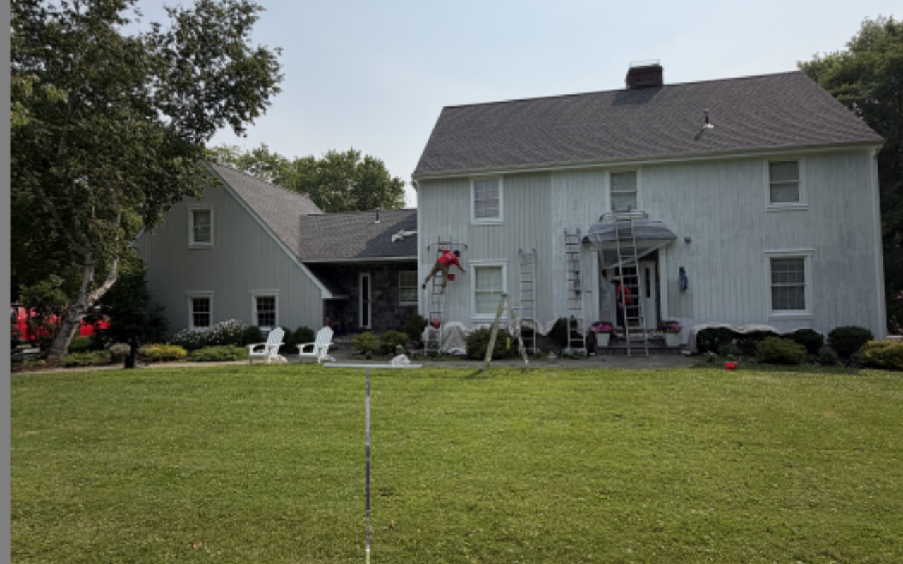 Exterior house repair and painting before fall weather arrives