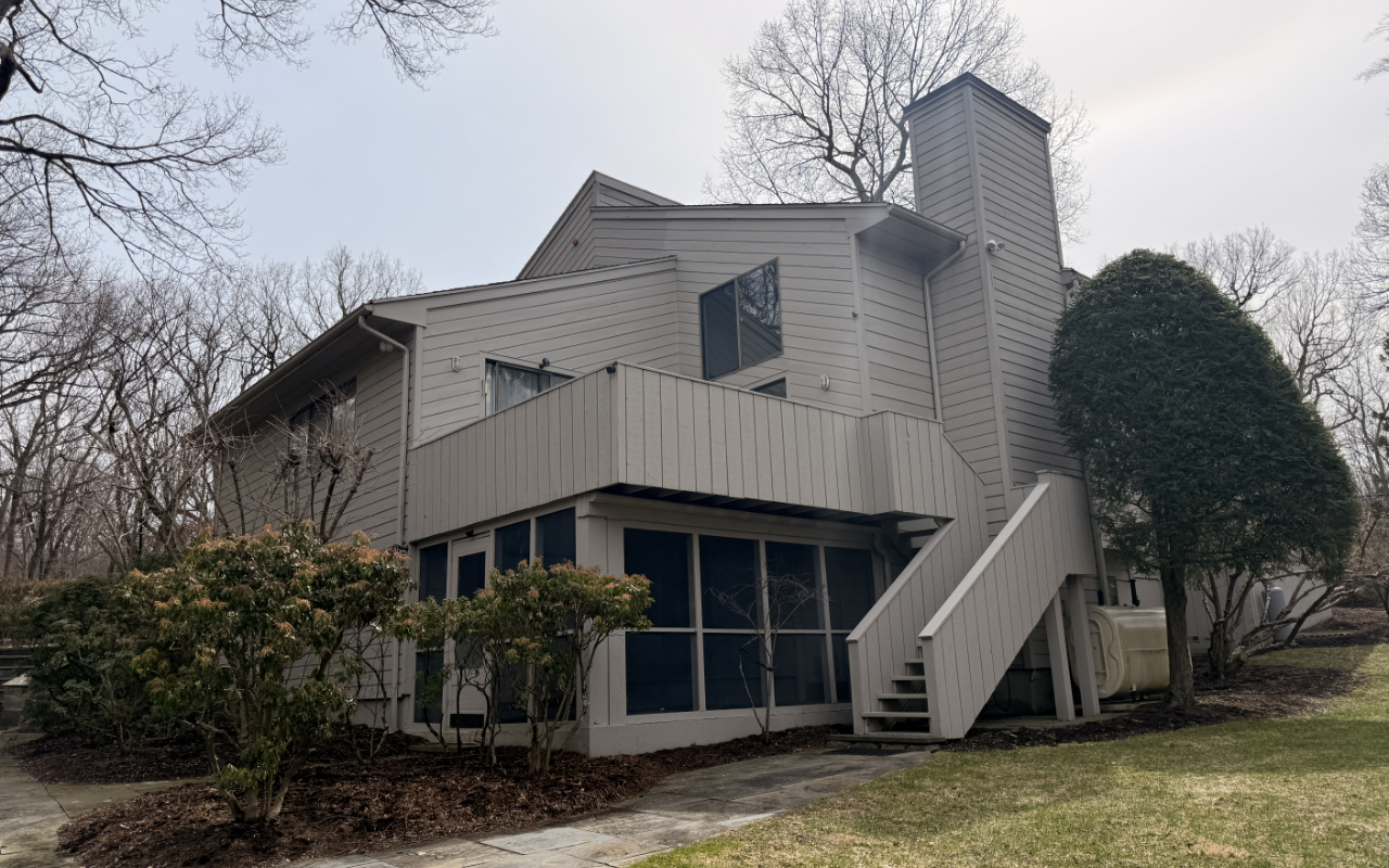 Exterior wood staining services applied to an outdoor deck before wet weather.