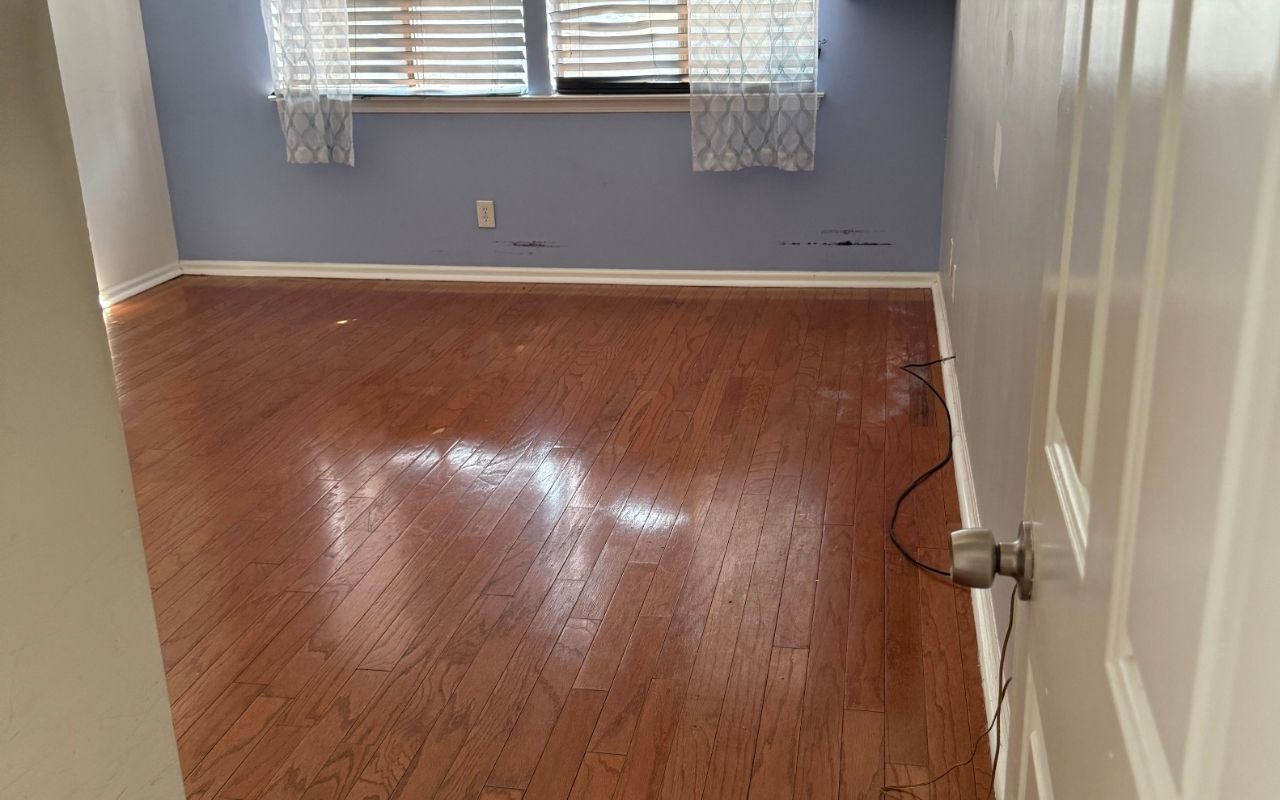 Interior paint wear signs on a living room wall with dull color and light scuffs