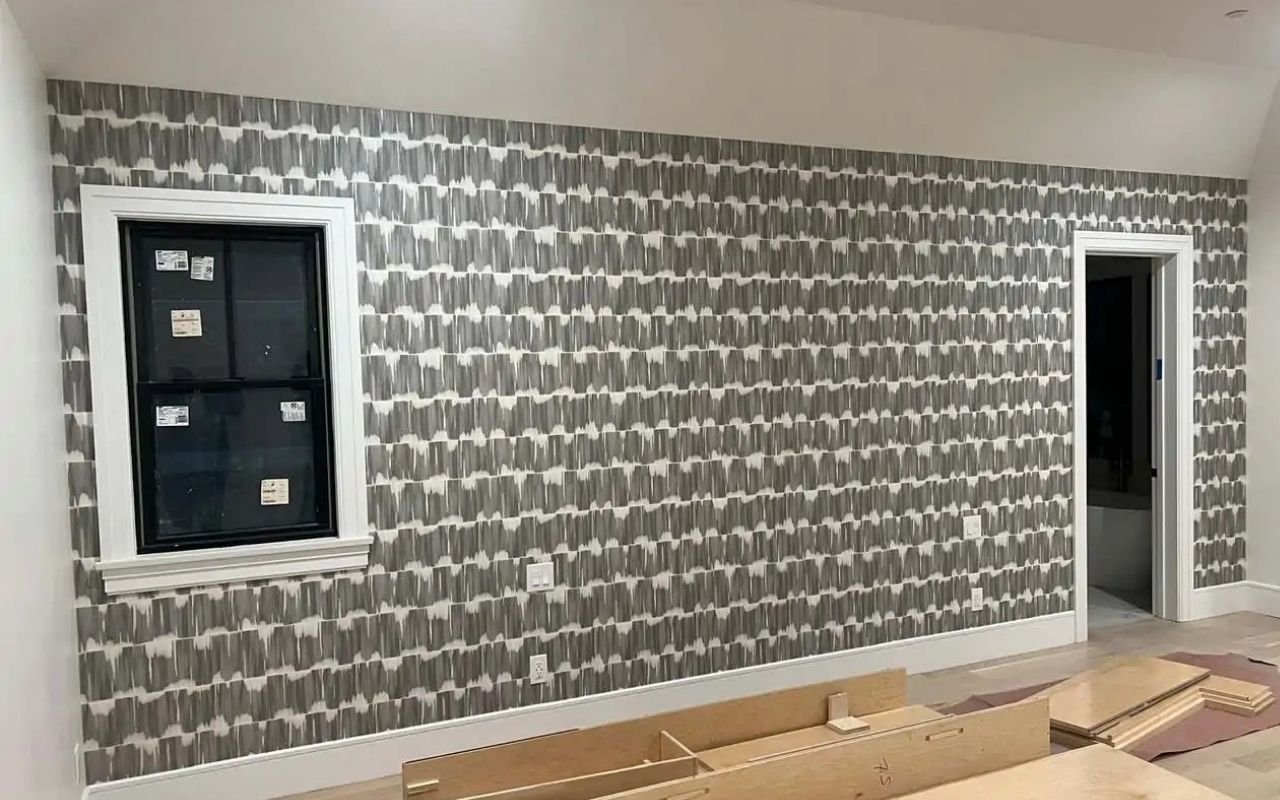 wallpaper installer benefits in a bright living room with smooth wall finish