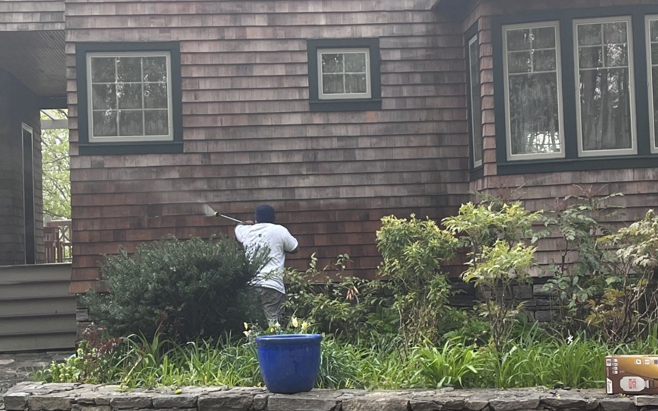 Power washing house siding for a cleaner home exterior