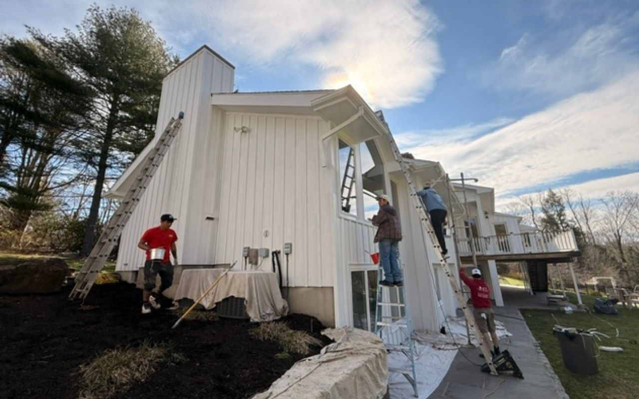 Summer exterior painting prep with trim repair before painting