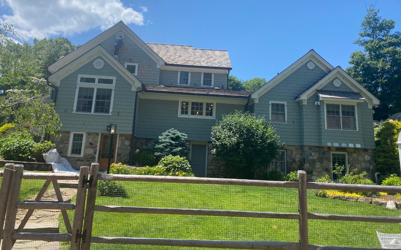 Contractor preparing to replace rotted exterior trim before storm season