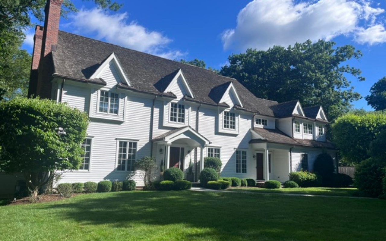 Summer heat exterior paint damage on a sun-exposed home