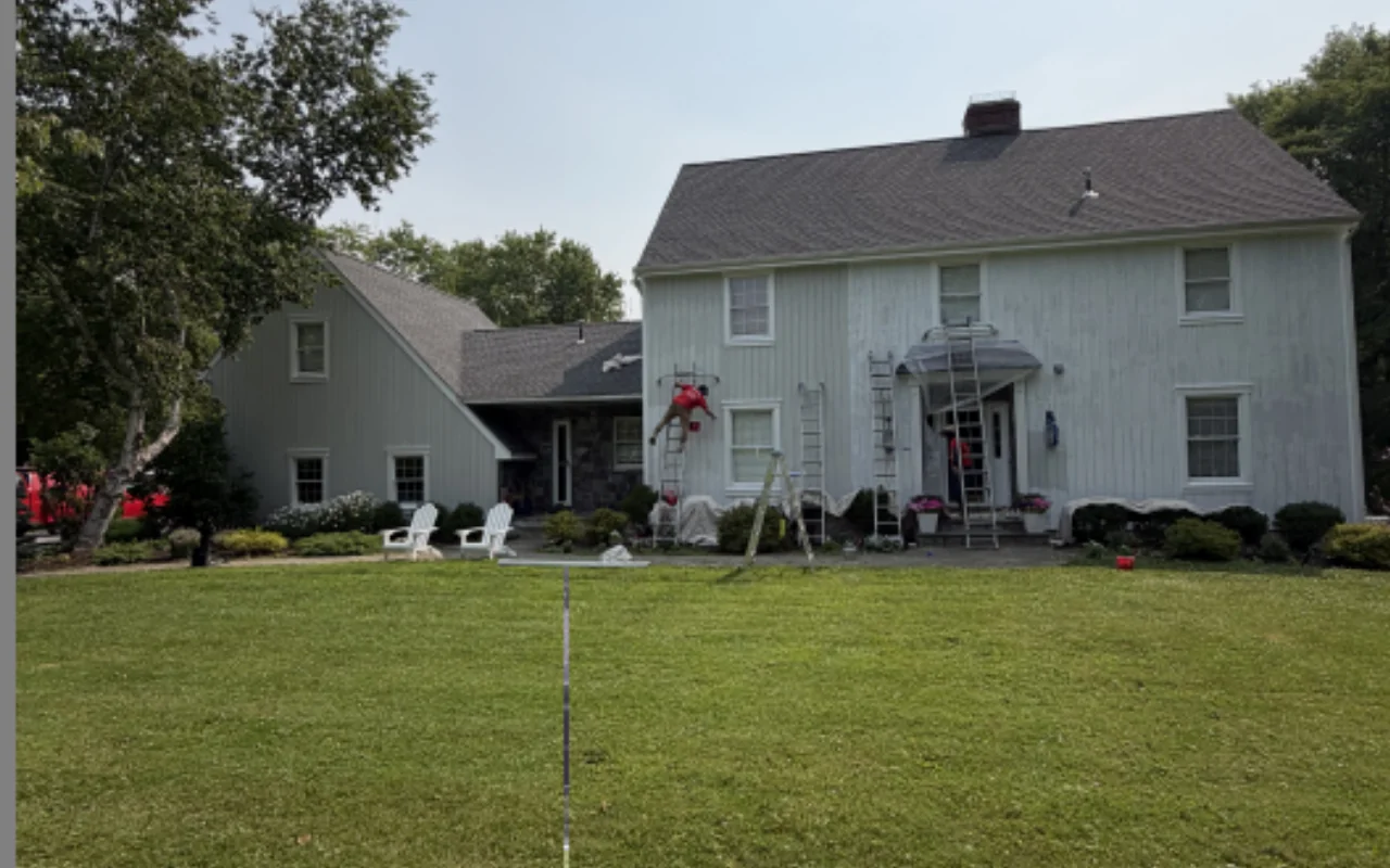 Exterior house repair and painting before fall weather arrives
