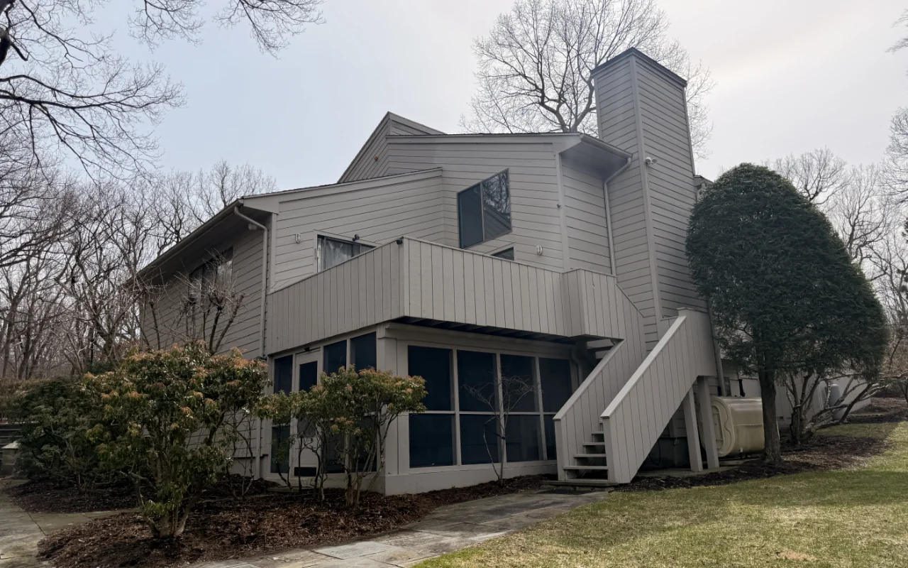 Exterior wood staining services applied to an outdoor deck before wet weather.