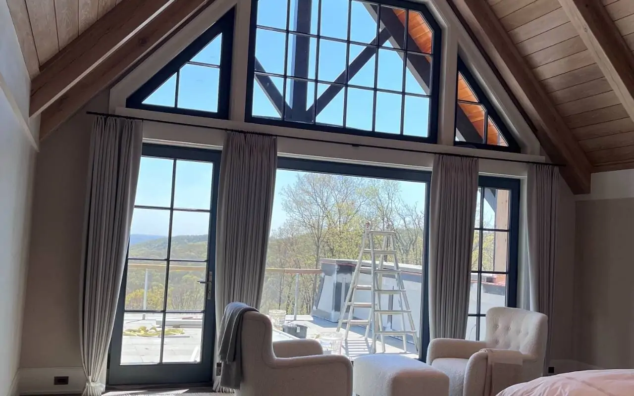 Winter Window Cleaning in Westchester bringing bright natural light into a cozy living room.