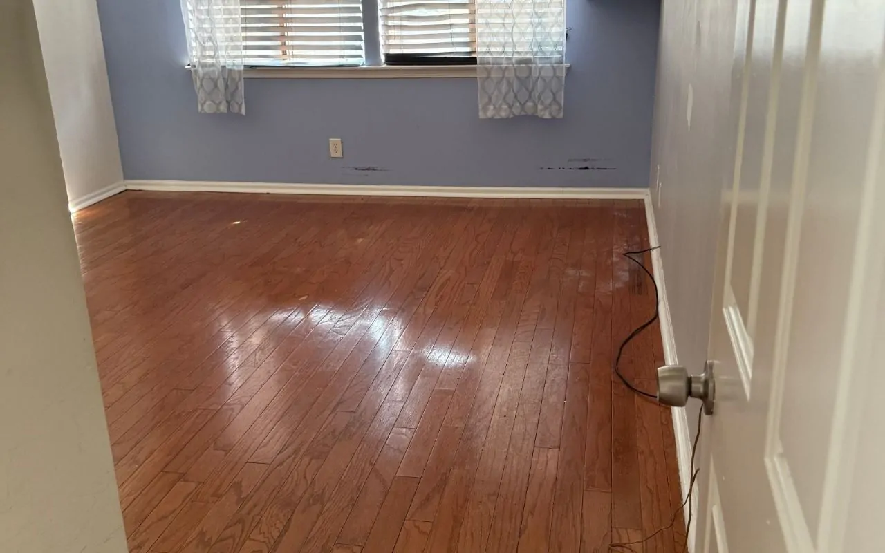 Interior paint wear signs on a living room wall with dull color and light scuffs